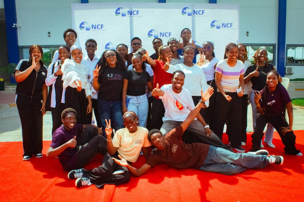 A large group of department members posing together outdoors