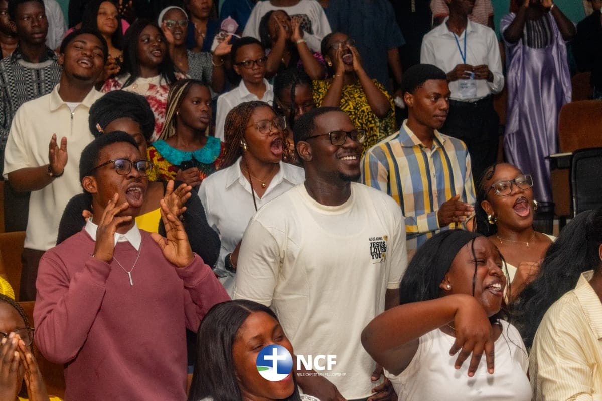 The congregation cheering and clapping during a service