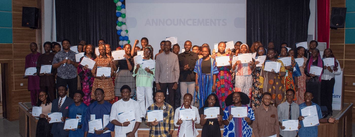 Students receiving certificates at a discipleship school graduation